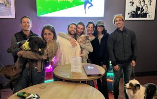 A group of friends with two dogs